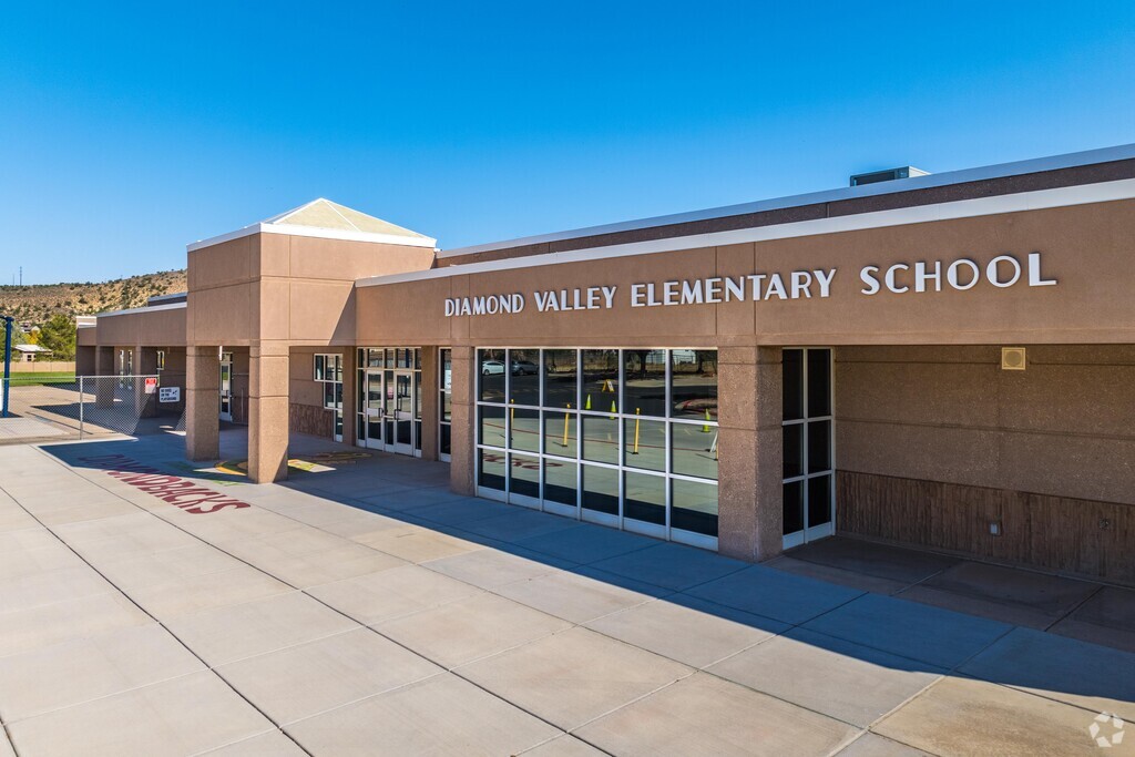 Front corner of school with metal letter on top edge stating it is Diamond Valley Elementary School.